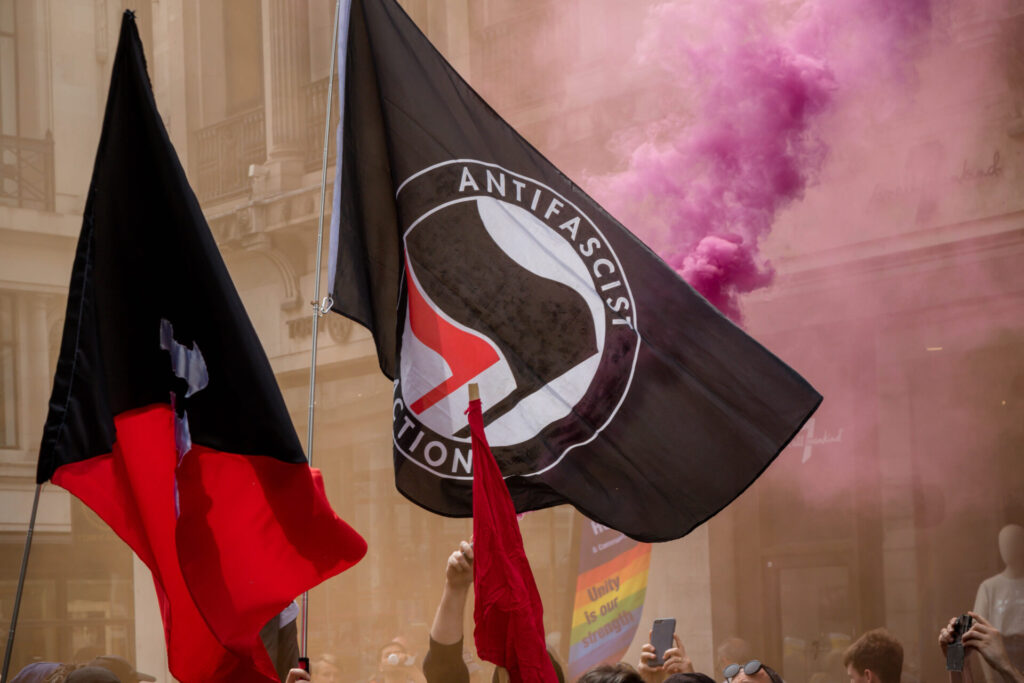 The antifa flag being displayed at an anti fascist demonstration in opposition to a rally by supporters of the former EDL leader Tommy Robinson